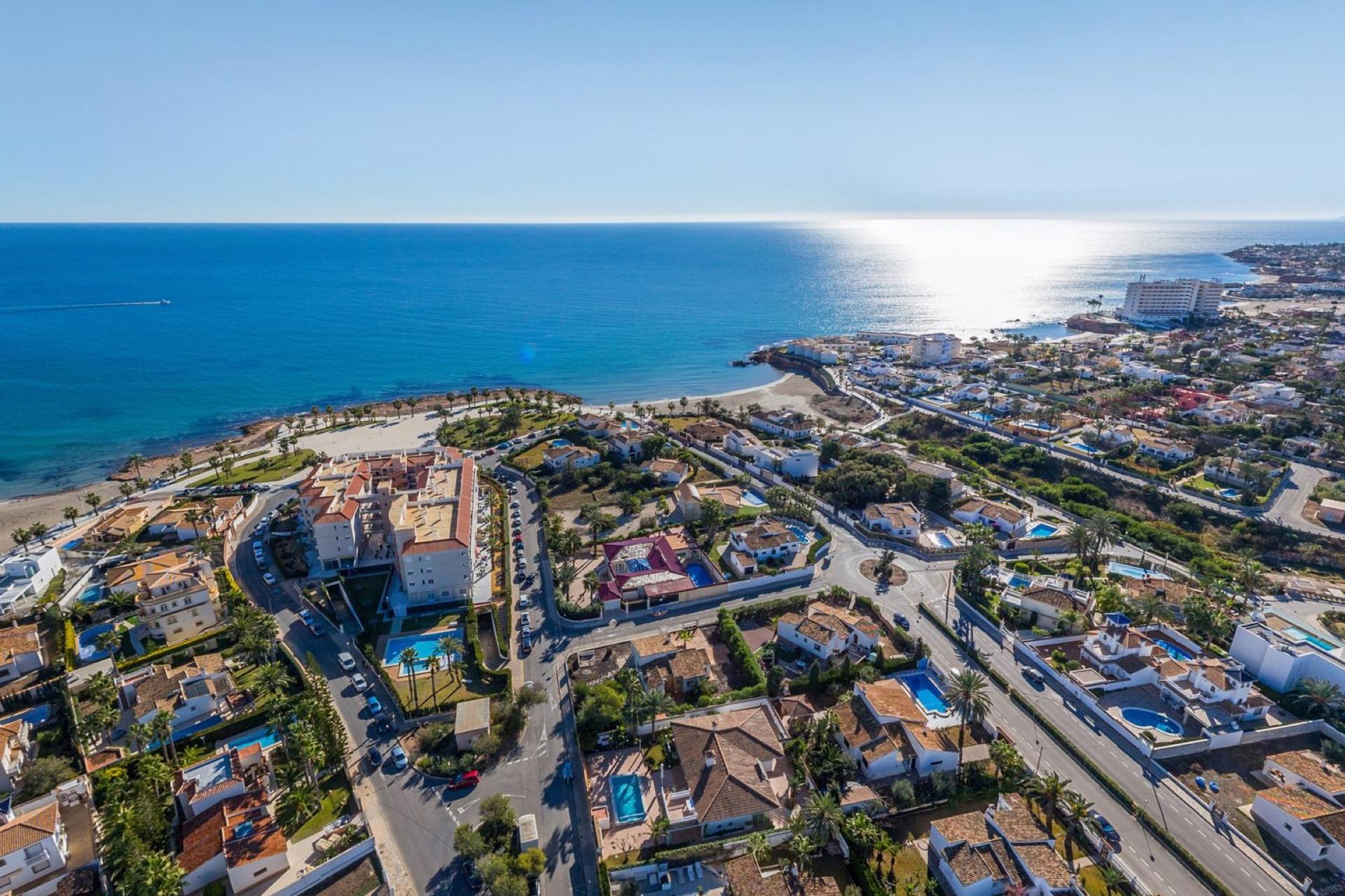 Playa Flamenca — Family-friendly Orihuela Costa beach zone with a wide sandy beach, lively promenade, and excellent value for apartment buyers.