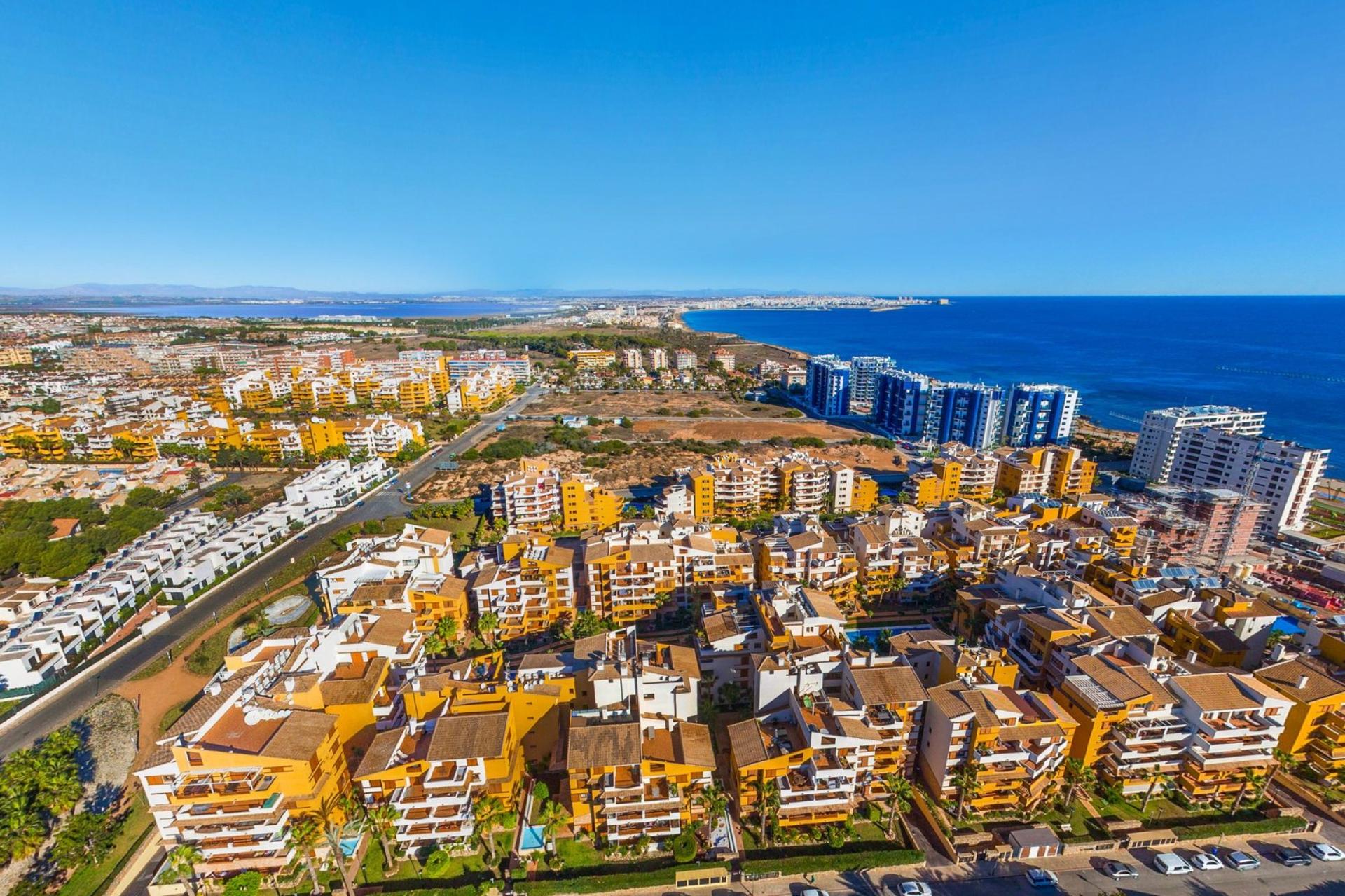 Punta Prima — Northernmost tip of Orihuela Costa — a sandy beach, seafront apartments, and direct walking access to Torrevieja's facilities.