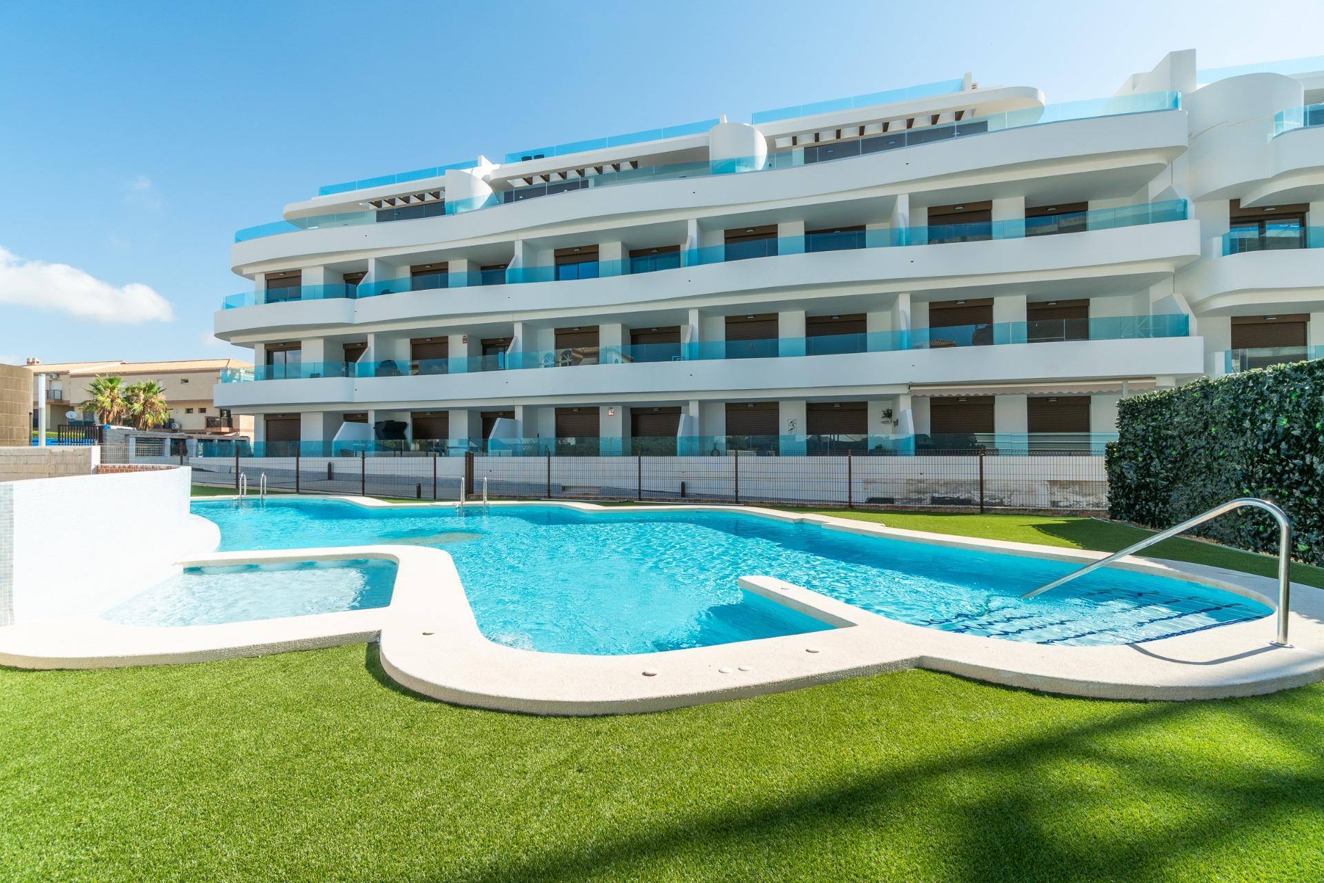 La Zenia — Orihuela Costa's most commercial and family-friendly zone — La Zenia Boulevard, a wide sandy beach, and modern apartment communities.