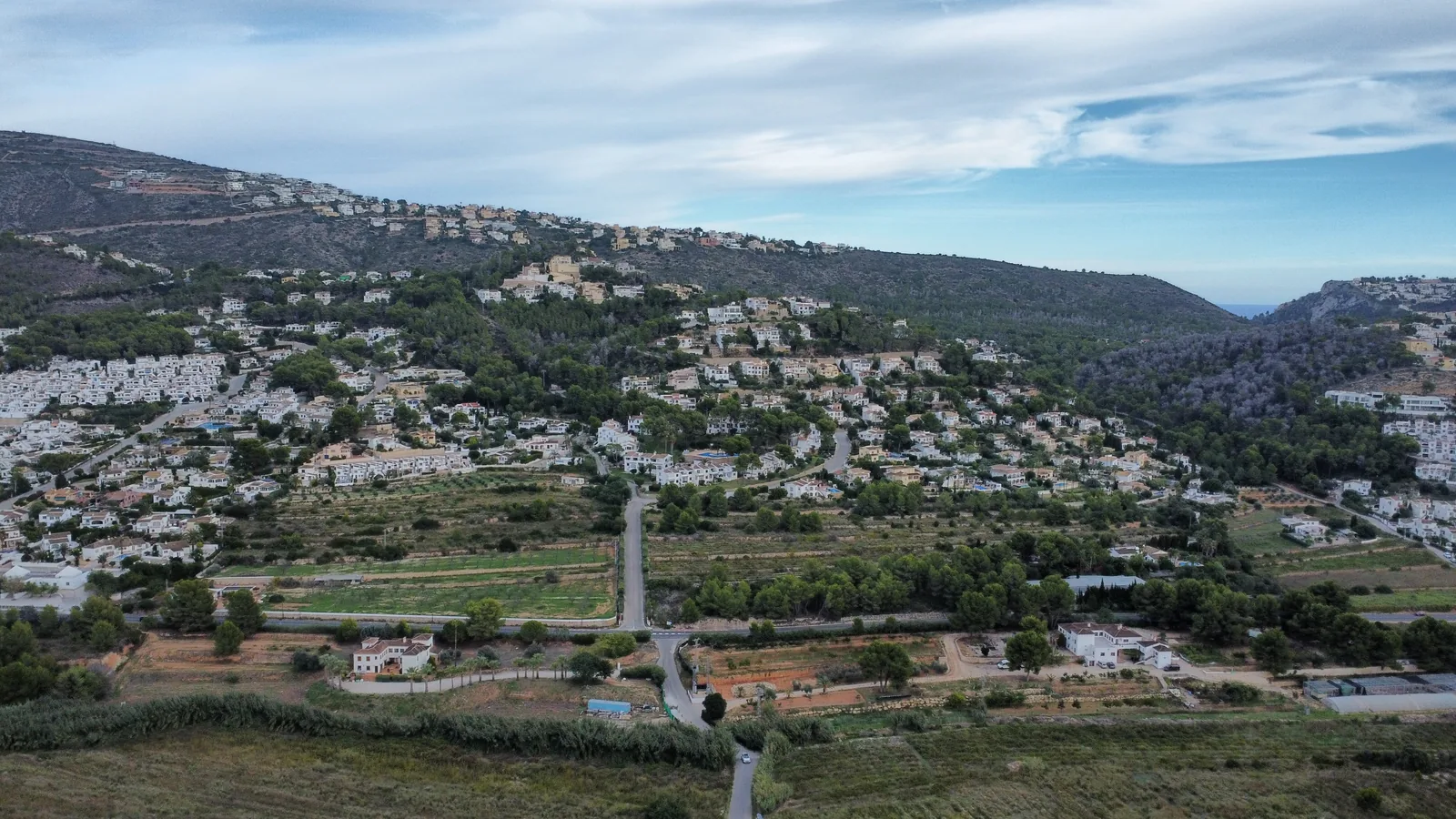Drone photograph looking from the estate towards Moraira and the coast, October 2026
